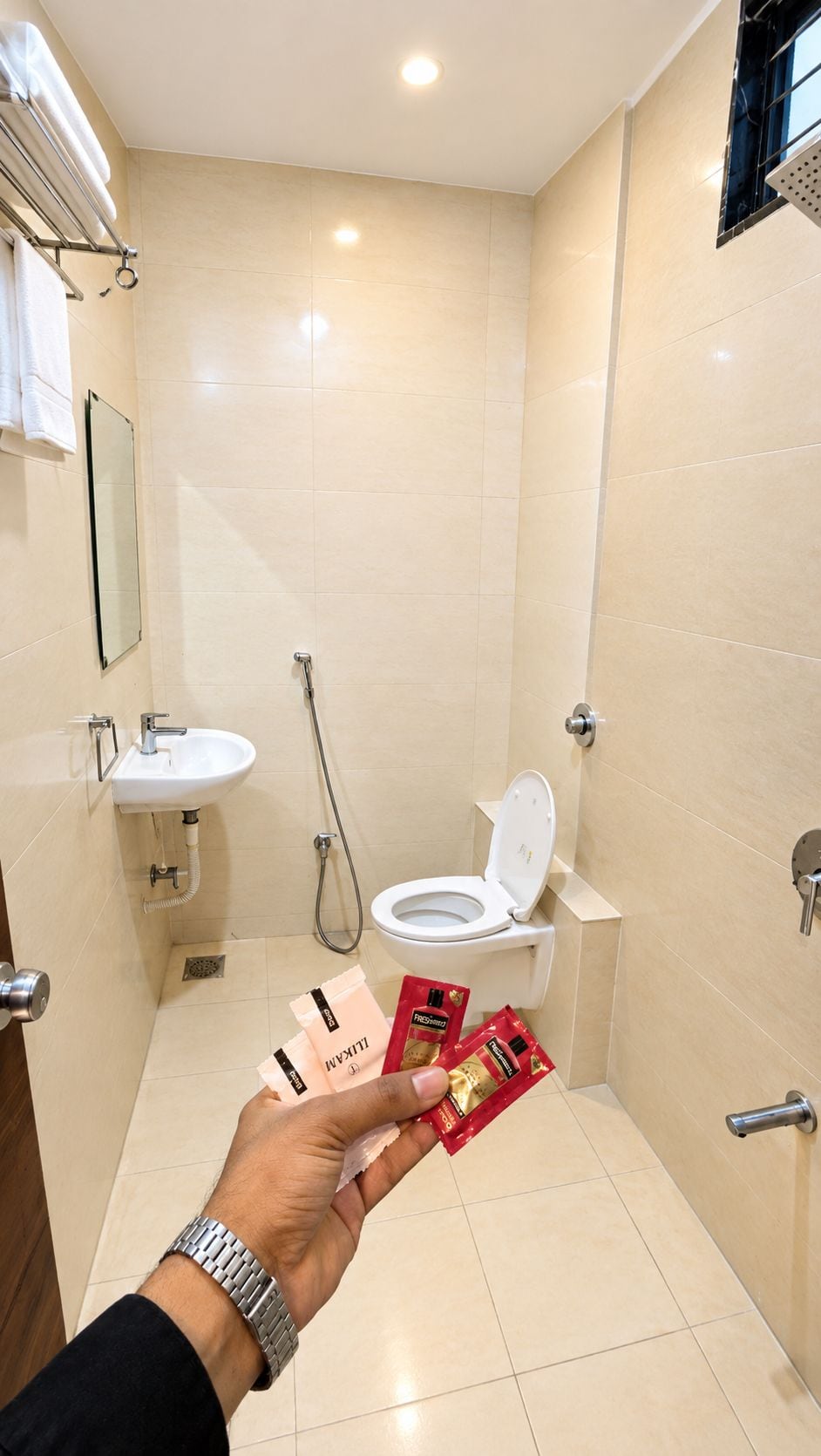 A bathroom with a sink, toilet, and shower.