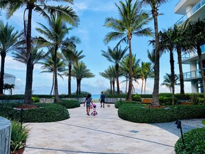 On the beach, white sand, sun-loungers, beach umbrellas