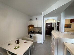 Fridge, microwave, high chair, cookware/dishes/utensils