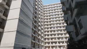 A high-rise residential building with multiple balconies and air conditioning units. - Relax 1BR Apartment at Sentul Tower (Citaringgul)