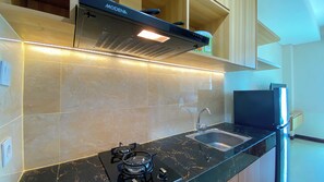 Standard Studio, 1 Bedroom (Apartment) | Private kitchen - Relaxing and Homey Studio Apartment at B Residence (Pagedangan)