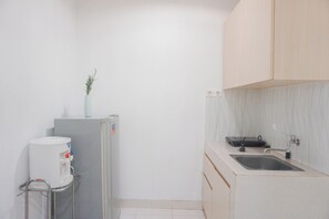 Private kitchen - Cozy Living 1BR at Sentul Tower Apartment (Citaringgul)