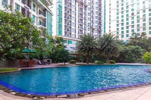 Outdoor pool - Comfy 2BR Apartment at Woodland Park Residence (Jakarta)