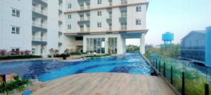Outdoor pool - Good 2BR Apartment Suncity Residence (Sidoarjo)