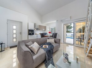 Villa (Three Bedroom House with Pool) | Living room | 32-inch flat-screen TV with satellite channels