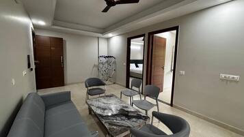 Deluxe Studio, Balcony | Living room | 32-inch LED TV with digital channels