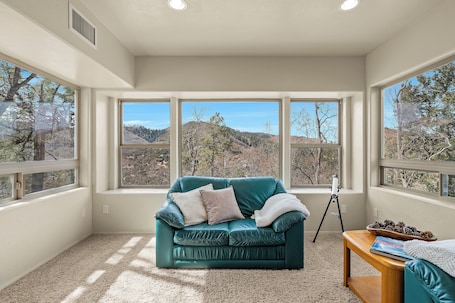 Living area. Arcade-Filled Mountain Escape at Little Bear Lodge