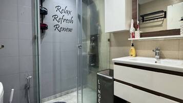 Shower, hair dryer, towels, soap