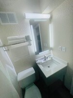 Shower, towels, soap, toilet paper
