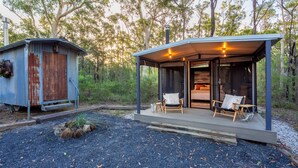 A cabin with a covered porch and a separate wooden structure. - The Hollows - Kangaroo Valley (Kangaroo Valley)