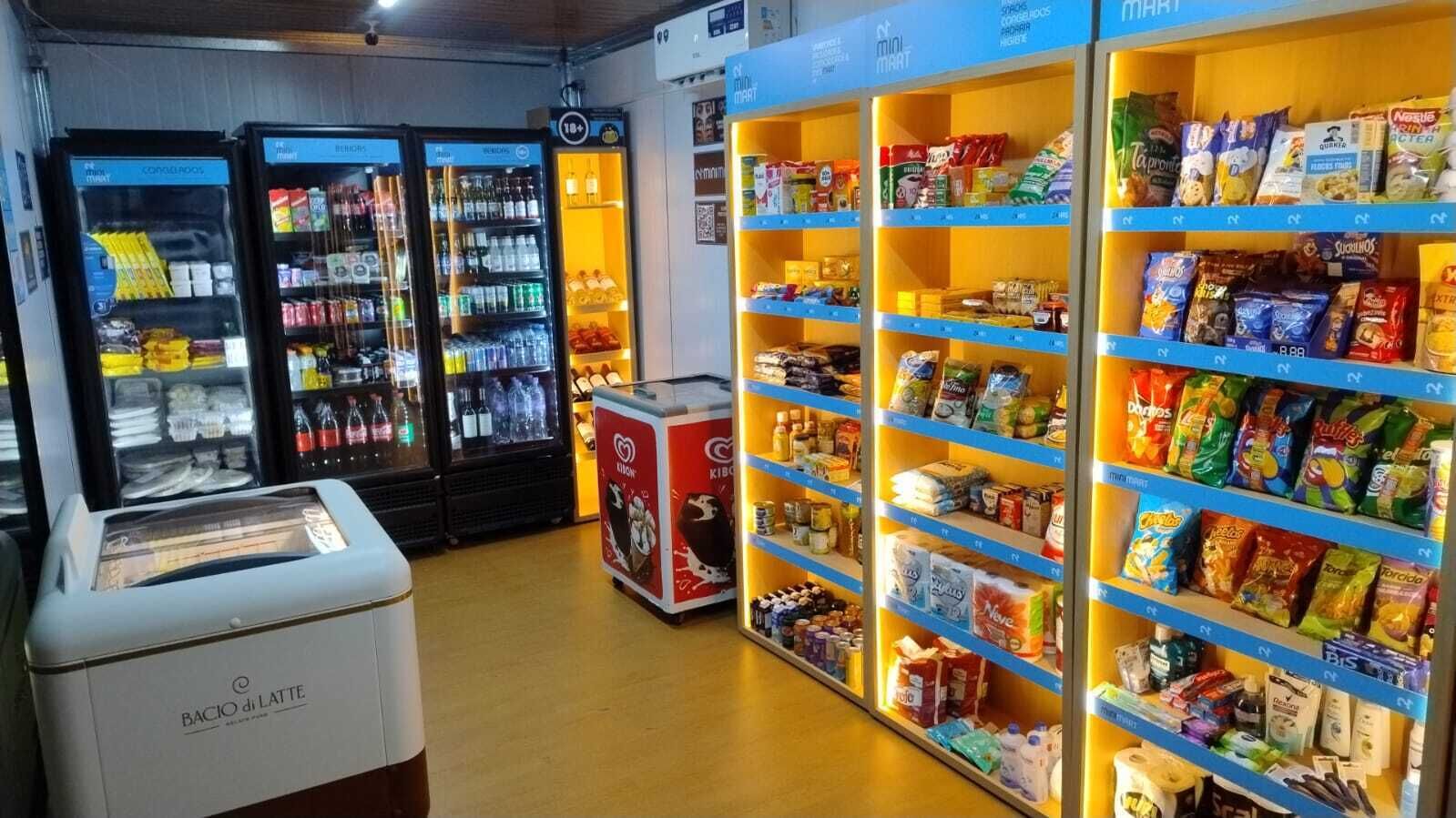 A self-service beverage station with refrigerated drinks and a milk cooler.