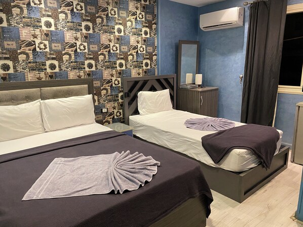 Deluxe Triple Room, City View | 1 bedroom, free minibar, laptop workspace, free WiFi