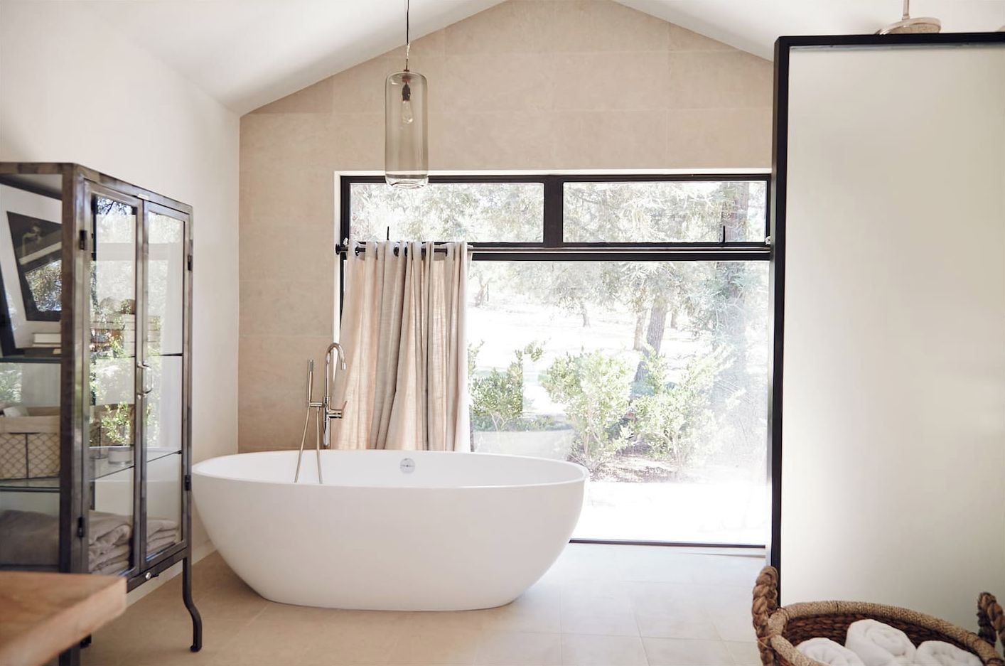 Main home bathroom with tub and 2 shower heads
