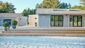 Main home on right and studio building with bedrooms 2 and 3 on the left