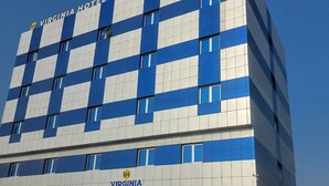 A modern building with a checkered facade, labeled "VIRGINIA HOTEL".