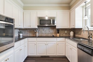 Fridge, microwave, oven, stovetop - Spacious 5BR Retreat Near Lake Hefner – Sleeps 12 + 2 car Garage (The Village)