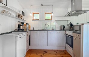 Fridge, stovetop, dishwasher, coffee/tea maker