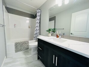 Hair dryer, towels, soap, toilet paper