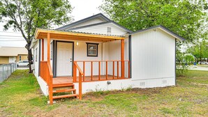 A small, single-story building with a porch and a door. - 1 Mi to Dtwn: Family Home w/ Porch in Brownwood (Brownwood)