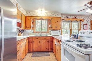 Fridge, microwave, stovetop, coffee/tea maker - Private Dock, Deck & Yard: Deerskin Lake Retreat! (Eagle River)