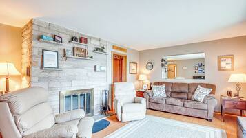 TV, fireplace, books