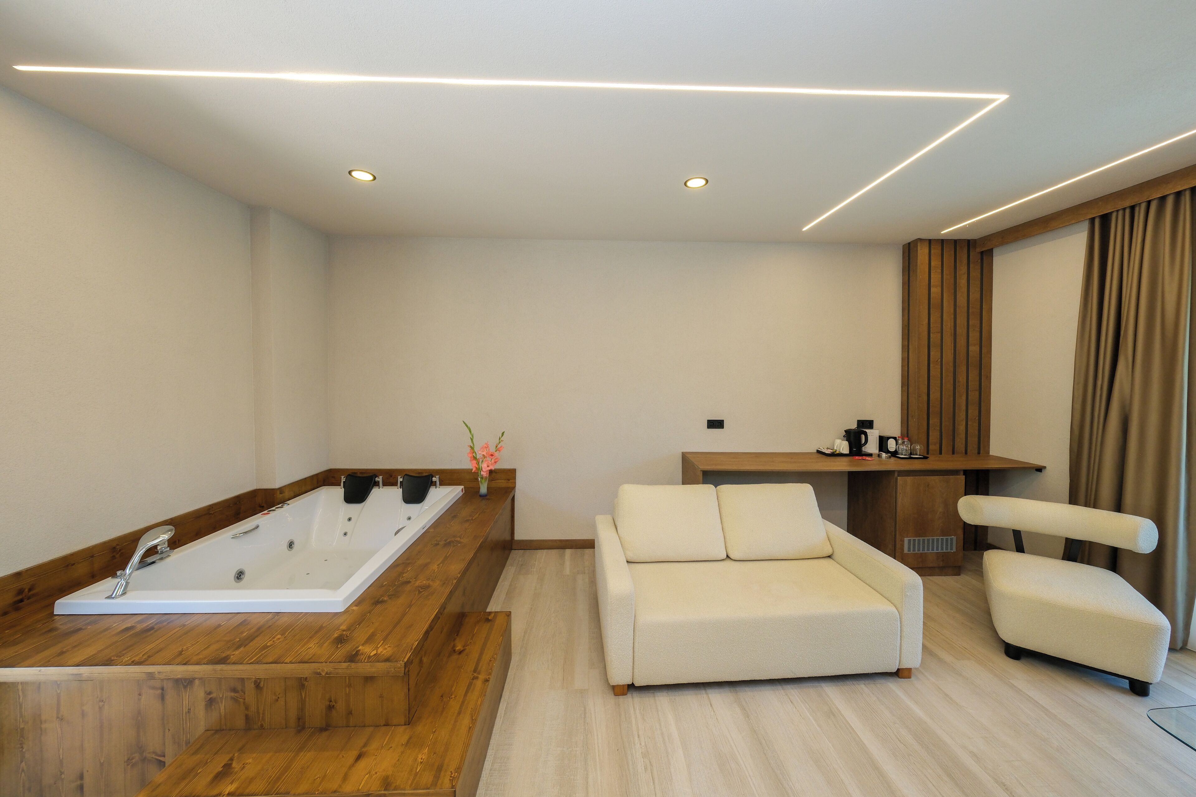 Premium Studio, Garden View | Living area | 42-inch LED TV with satellite channels