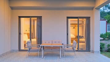 Superior Triple Room, Garden View | Terrace/patio