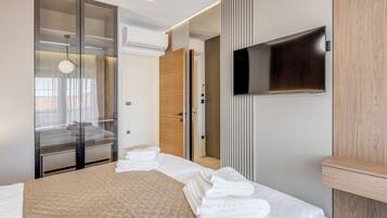 Villa – deluxe | Sengetøy av topp kvalitet, safe på rommet og strykejern/-brett