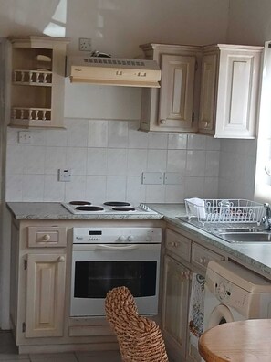 Enjoy casual meals in this kitchen with a central island, oven, and dishwasher.