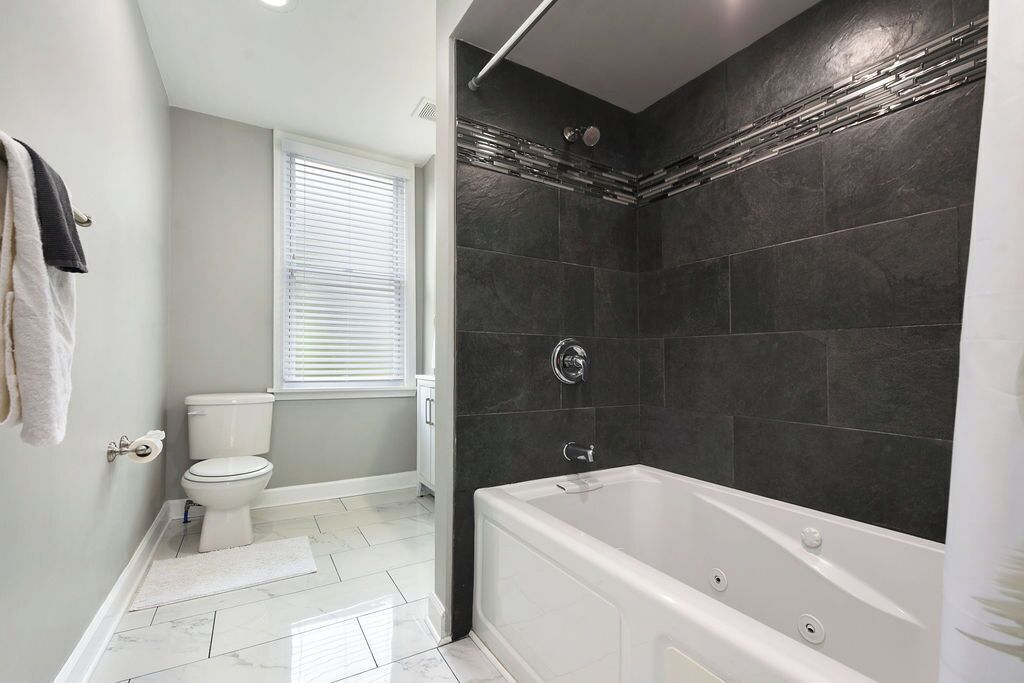 Shower, jetted tub, hair dryer, towels