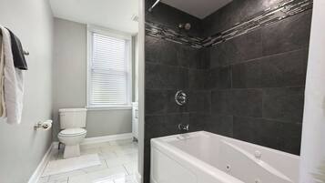Shower, jetted tub, hair dryer, towels