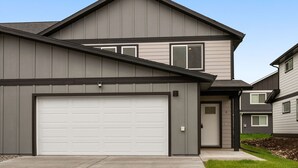 A modern two-story house with a garage, a front door, and a small porch. - Fireside Retreat (Belgrade)