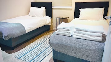 2 dormitorios, tabla de planchar con plancha, wifi gratis y ropa de cama