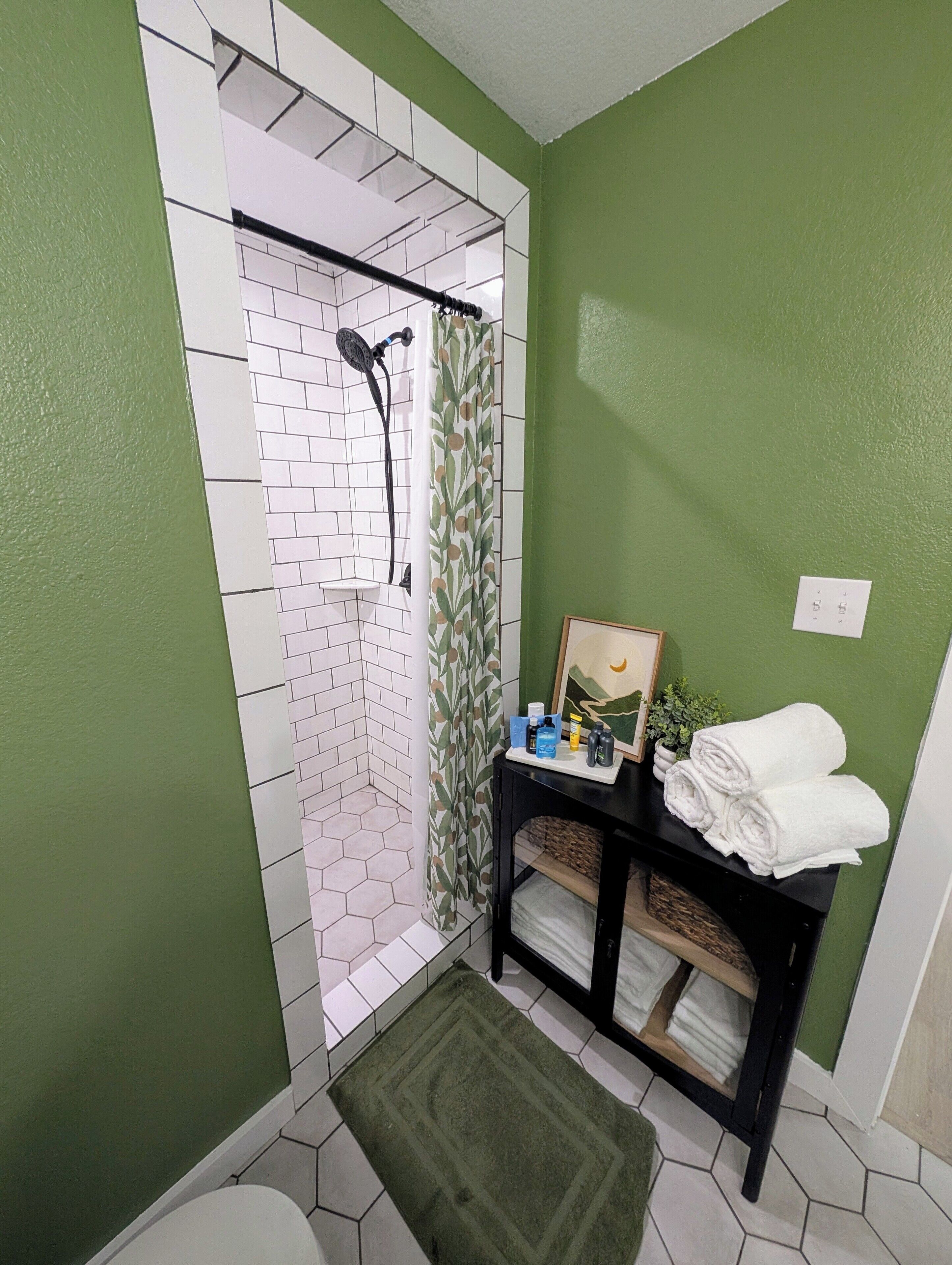 Shower, towels, soap, toilet paper