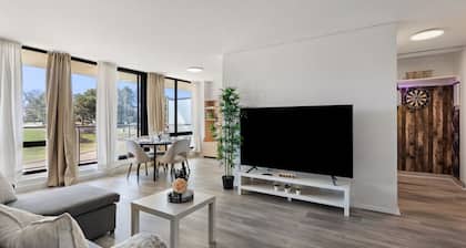 Stylish 1BR with King Bed, Patio, Dart Room, and Free Parking – 10 min to SQ1