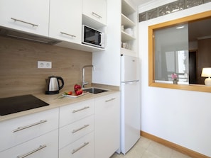 Fridge, microwave, cookware/dishes/utensils