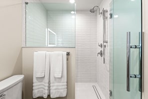 Shower, hair dryer, towels, soap