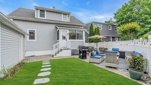 A backyard with a stone path, outdoor furniture, and a potted plant. - 2Blocks 2Beach | Free Coffee | Linens+Towels | AC (Belmar)