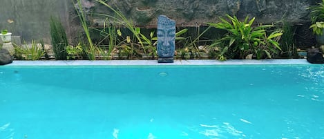 Outdoor pool, open 7:00 AM to 10:00 PM, sun loungers