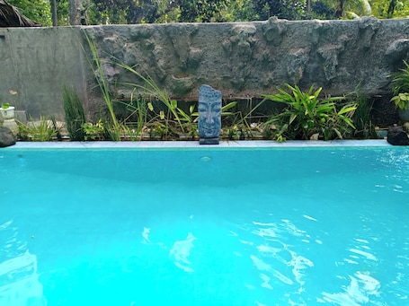 Outdoor pool, open 7:00 AM to 10:00 PM, sun loungers