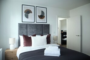 1 bedroom, desk, iron/ironing board, travel crib