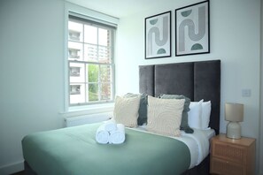 1 bedroom, desk, iron/ironing board, travel crib