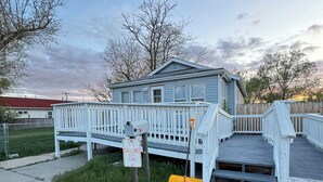 A house with a covered porch and a 'No Parking Any Time' sign.