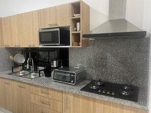 Fridge, microwave, stovetop, coffee/tea maker