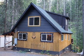 A cabin with a dark roof, a wooden front section, and a number '2373' on the wall. - Creekside Cabin+Fire Pit+Lakes Nearby+Wine Tasting+Bear Valley Ski Resort (Arnold)