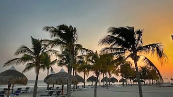 On the beach, sun loungers