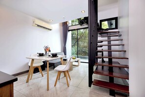 Design Condo, 1 Bedroom, Balcony | Living area | 46-inch flat-screen TV with cable channels