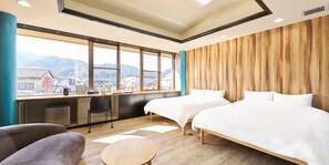 A hotel room with two beds, a desk, a chair, and a view of a cityscape. - MarketStay shingu (Shingu)