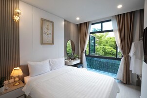 Quarto standard, sacada, vista para a cidade | Wi-Fi de cortesia, roupa de cama