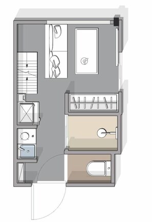 A floor plan of a hotel room with a bathroom, a bed, a desk, and a small seating area.